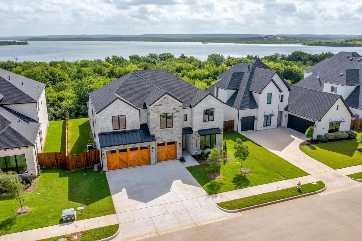 Aerial view of a street of completed Parkwood homes with open country beyond